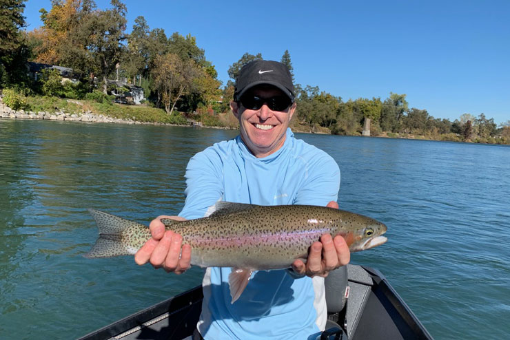 A guest with a great wild rainbow trout from the Lower Sac
