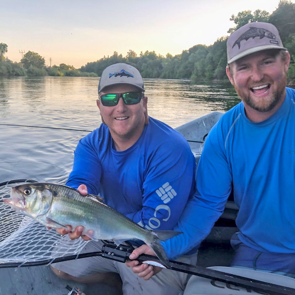 Guide Ben Thompson and guest with a shad on the American River